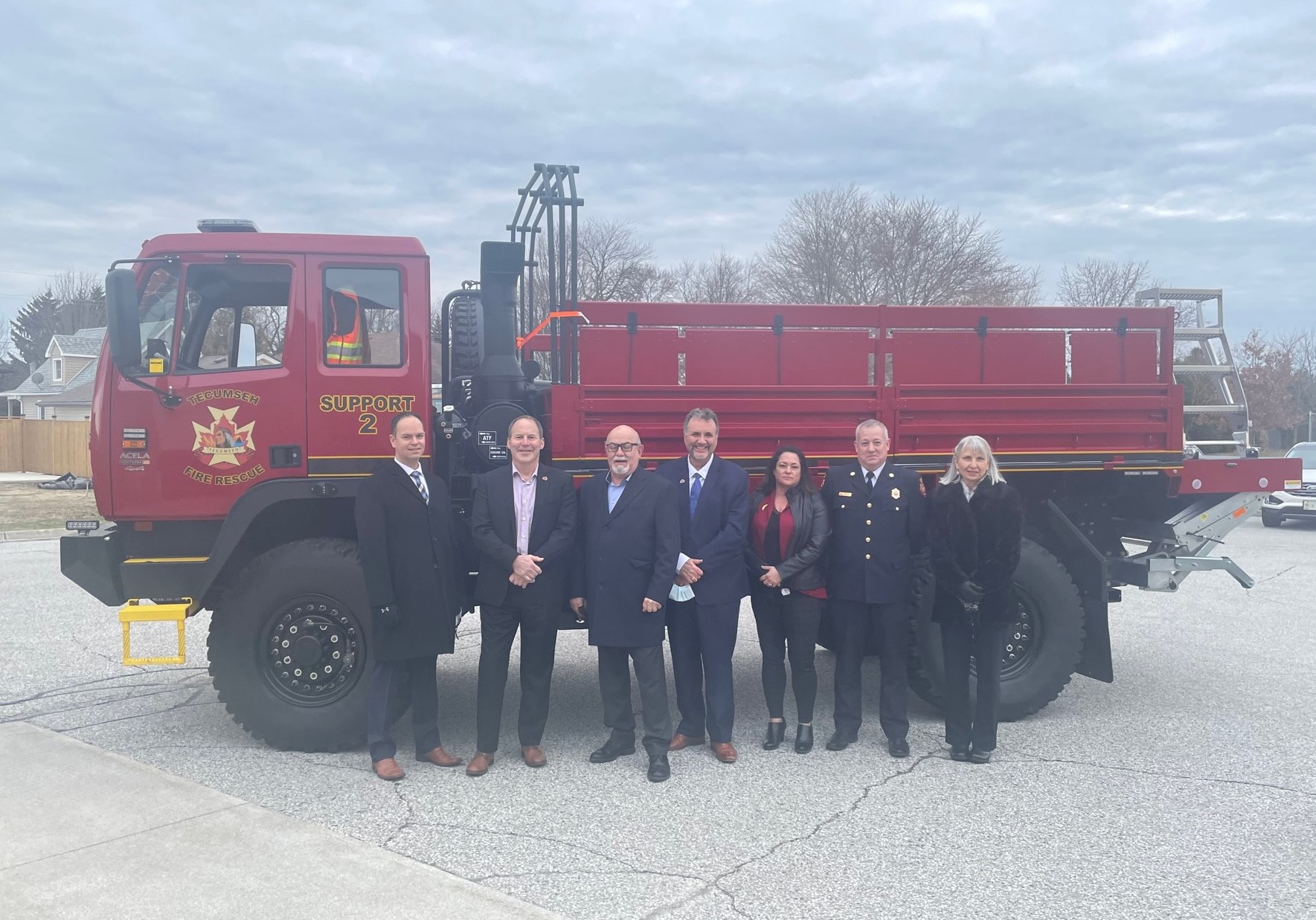 Council standing in front of new high water rescure vehicle