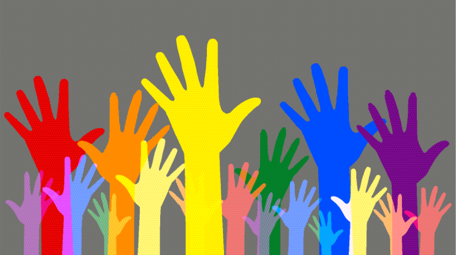 volunteer multi coloured hands raising